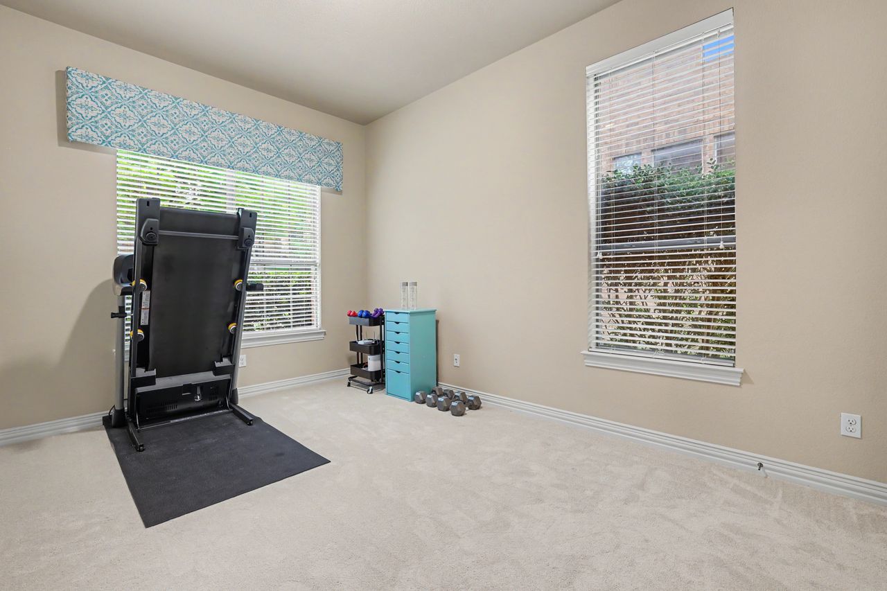 2828 Collingwood Drive Round Rock, TX 78665 - Photo 20 of 38 a room with a window and gym equipment