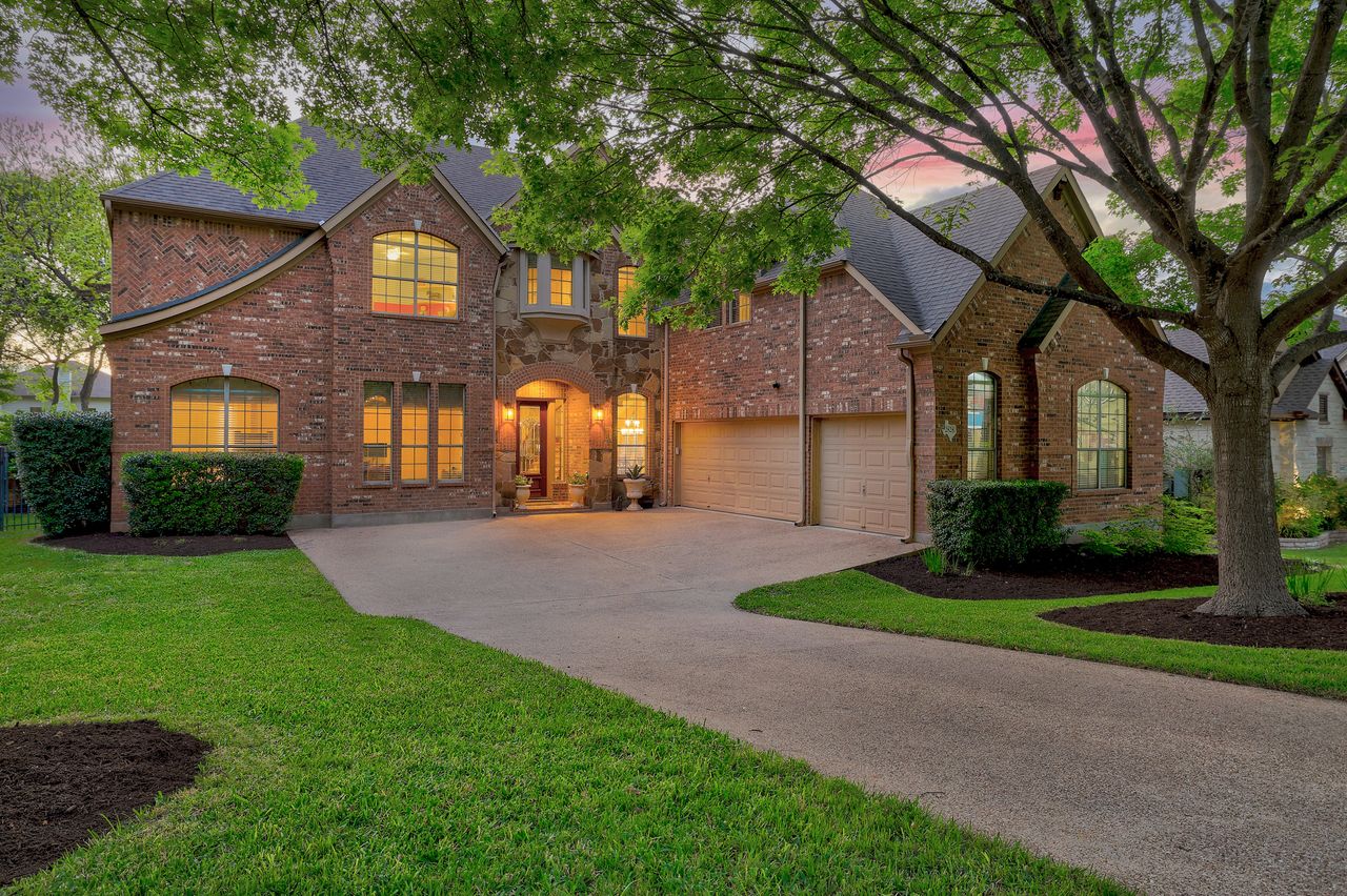2828 Collingwood Drive Round Rock, TX 78665 - Photo 2 of 38 a front view of a house with a yard and garage