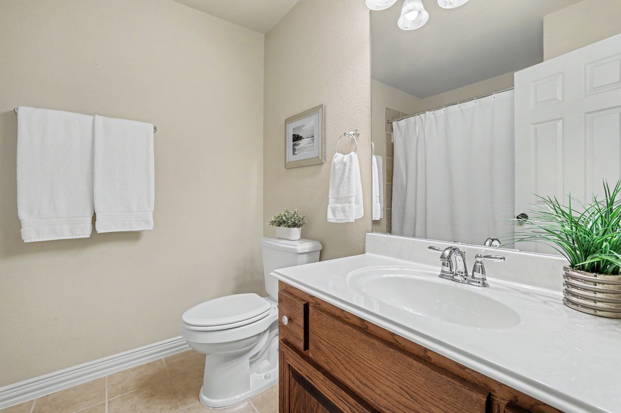 2828 Collingwood Drive Round Rock, TX 78665 - Photo 23 of 38 a bathroom with a sink a toilet and tub