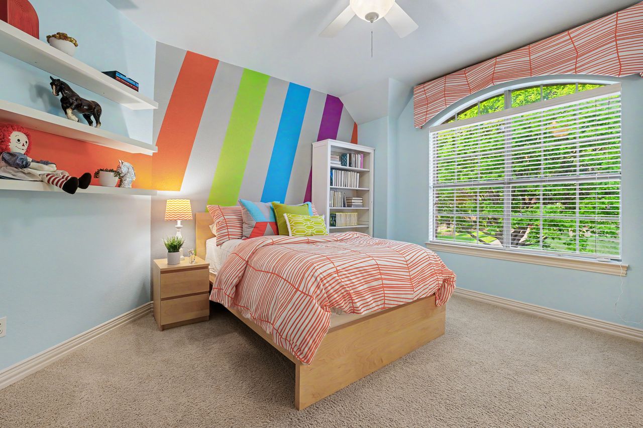2828 Collingwood Drive Round Rock, TX 78665 - Photo 24 of 38 a bed room with a bed and a chair