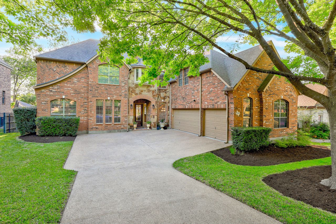 2828 Collingwood Drive Round Rock, TX 78665 - Photo 37 of 38 a front view of a house with a yard and garage