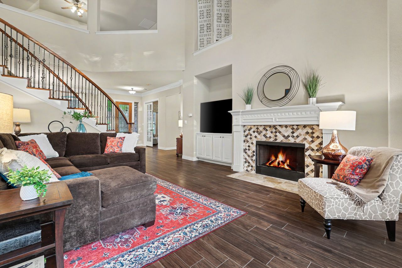2828 Collingwood Drive Round Rock, TX 78665 - Photo 10 of 38 a living room with furniture and a fireplace
