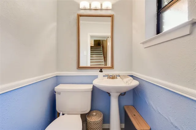 a kitchen with granite countertop a refrigerator and a sink