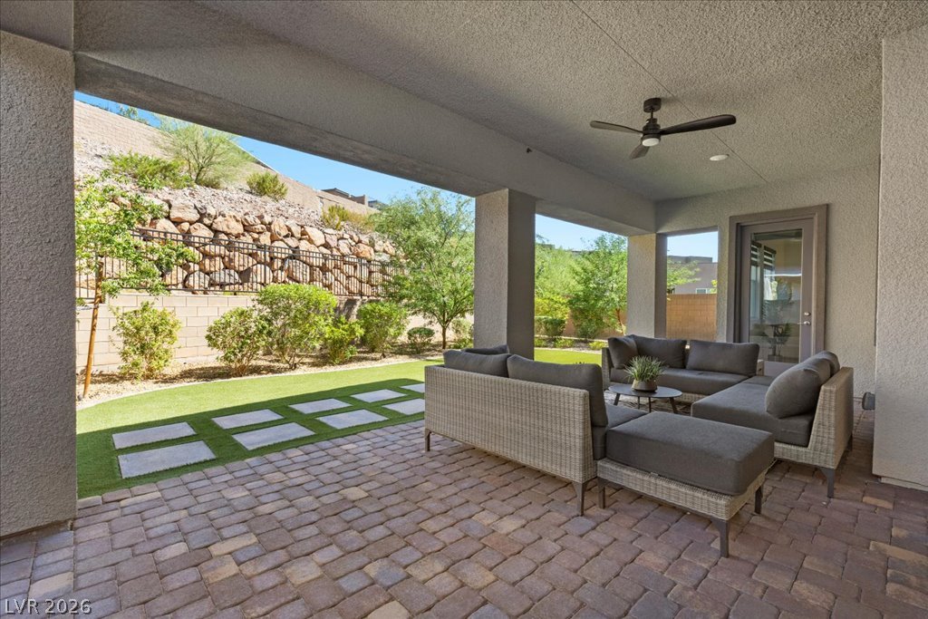 20 Charlotte Ridge Place Henderson, NV 89011 - Photo 26 of 33 A spacious covered patio provides a shaded oasis for outdoor lounging.