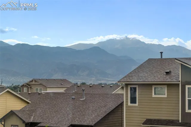 a aerial view of a house with a yard