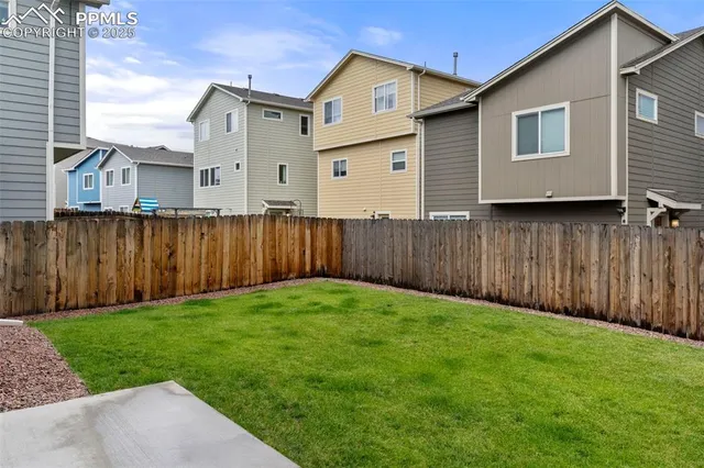 a view of a back yard of the house