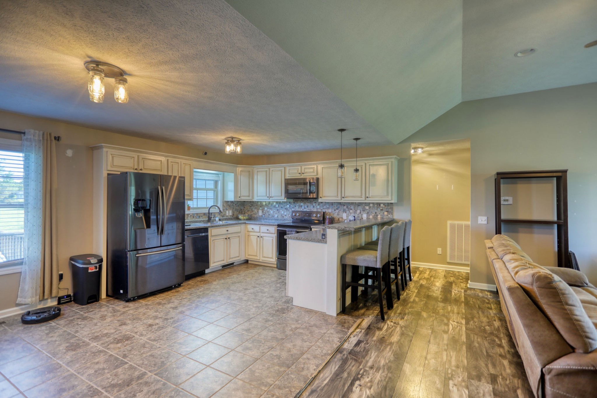3678 Galen Road Lafayette, TN 37083 - Photo 8 of 23 a kitchen with refrigerator and cabinets