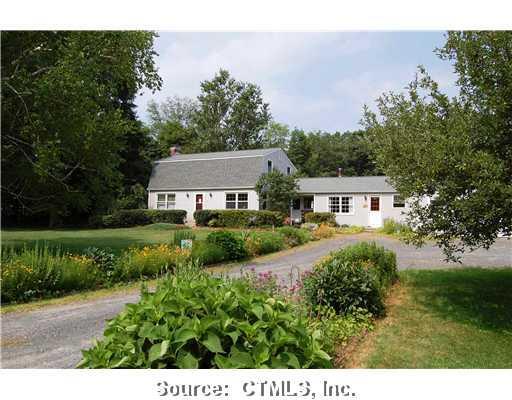 13 Strong Road Granby, CT 06090 - Photo 1 of 1 a front view of a house with a yard