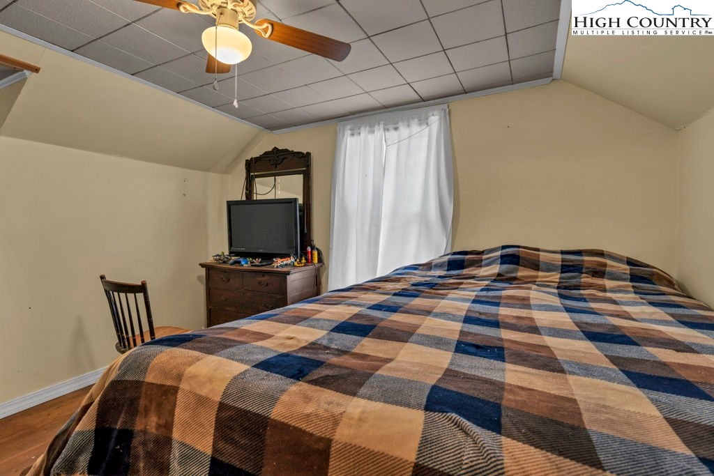 1068 Laurel Branch Road Vilas, NC 28692 - Photo 18 of 33 a bedroom with a bed and a view of balcony