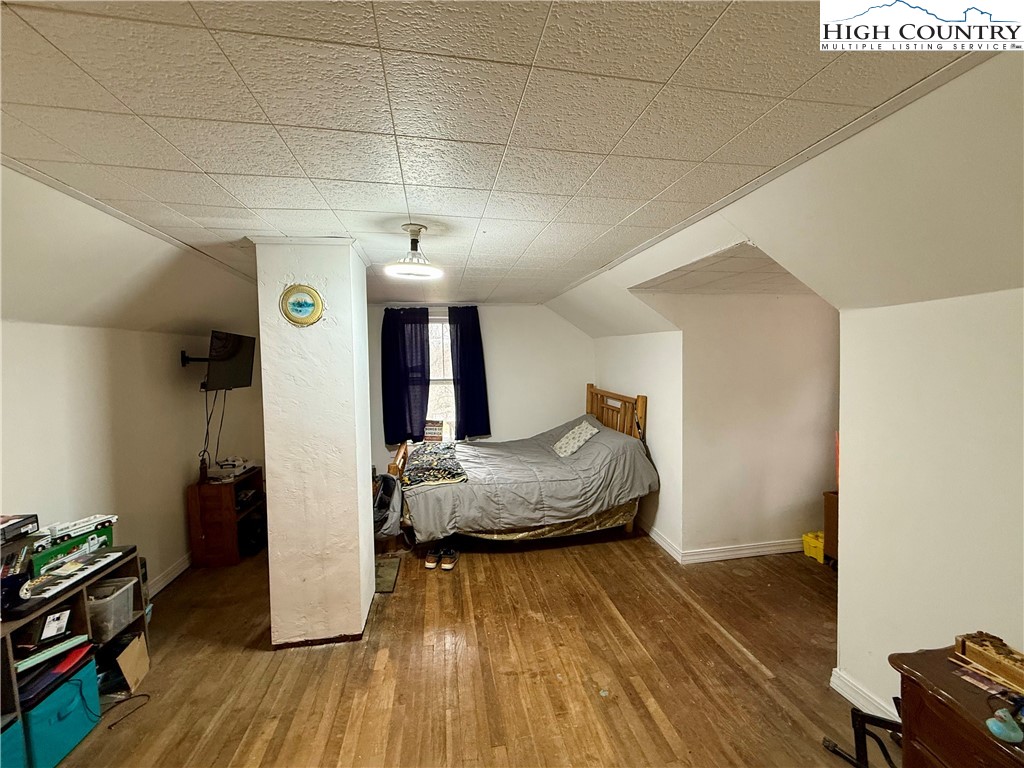 1068 Laurel Branch Road Vilas, NC 28692 - Photo 19 of 33 a living room with furniture and a wooden floor