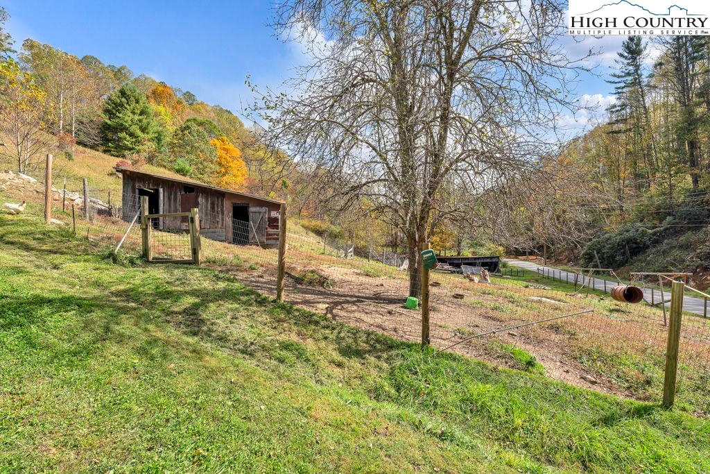 1068 Laurel Branch Road Vilas, NC 28692 - Photo 24 of 33 a view of a house with a yard