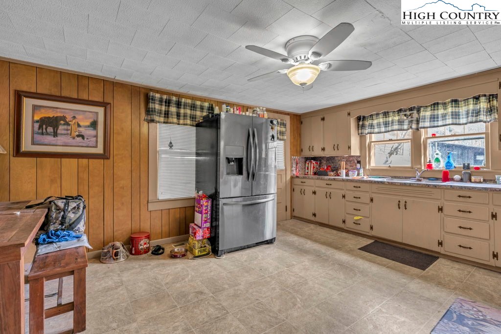 1068 Laurel Branch Road Vilas, NC 28692 - Photo 3 of 33 a kitchen with stainless steel appliances a stove a refrigerator and cabinets