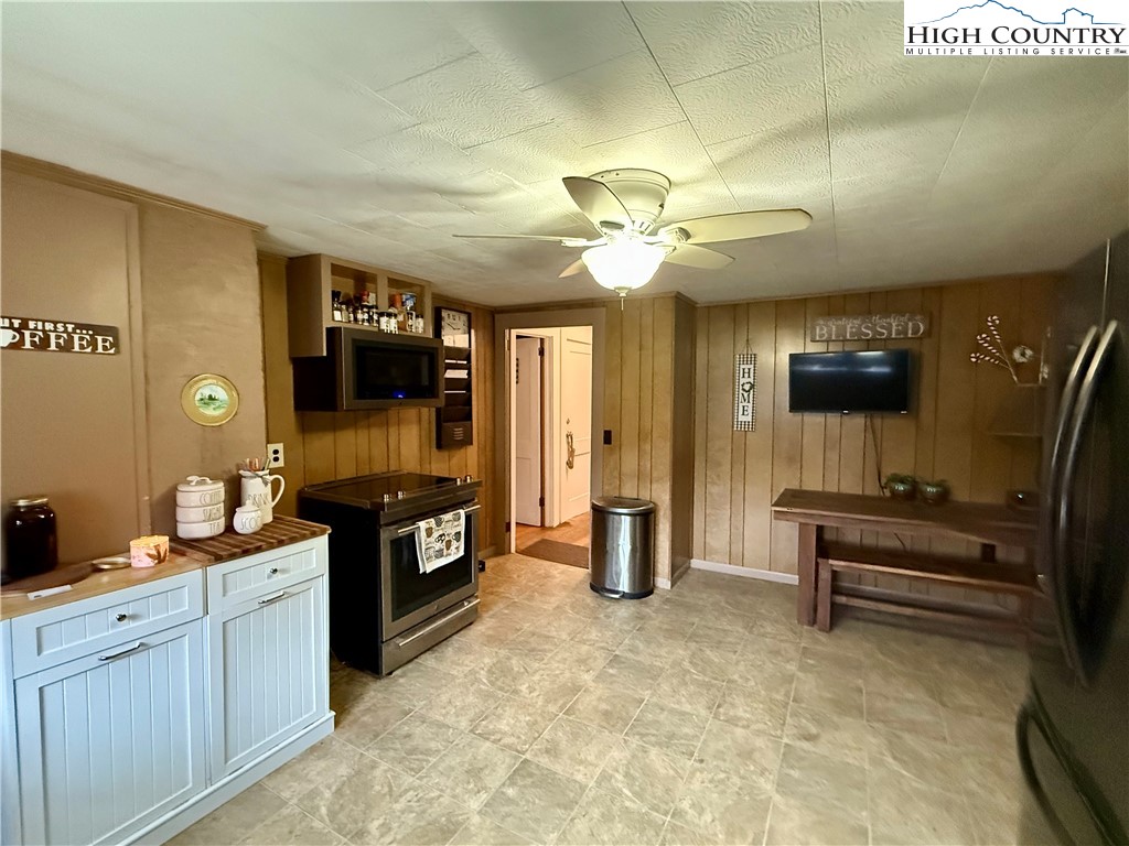 1068 Laurel Branch Road Vilas, NC 28692 - Photo 7 of 33 a large kitchen with stainless steel appliances granite countertop a stove and a sink