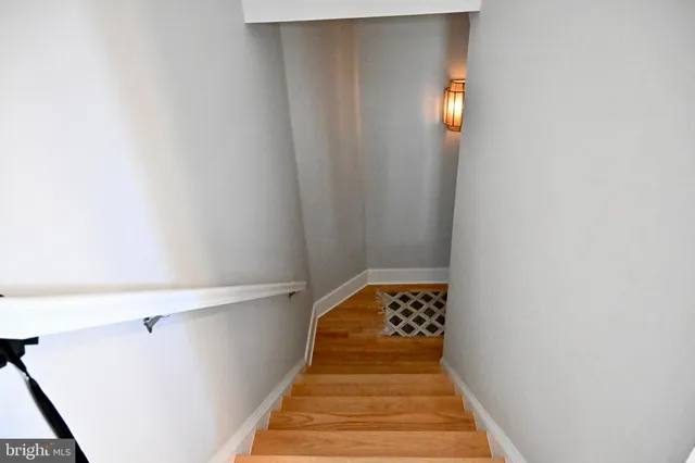 a bathroom with a sink vanity and mirror