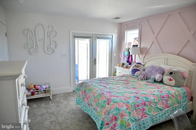 a view of a hallway with paintings on the wall