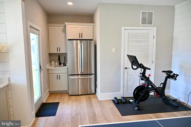 a living room with furniture rug and wooden floor