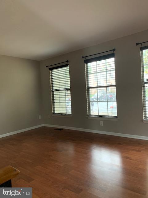 16 Cinzano Court Gaithersburg, MD 20878 - Photo 2 of 22 an empty room with wooden floor and windows