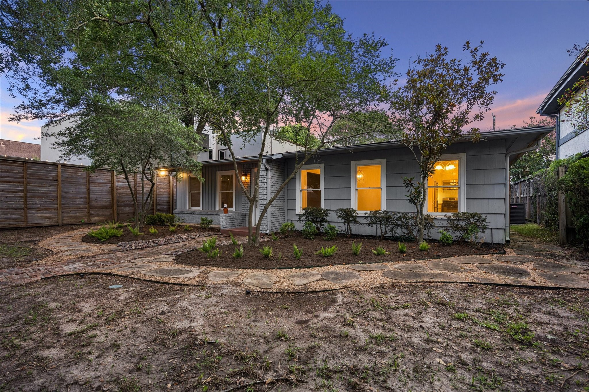 1931 Bissonnet Street Houston, TX 77005 - Photo 3 of 22 a front view of a house with garden