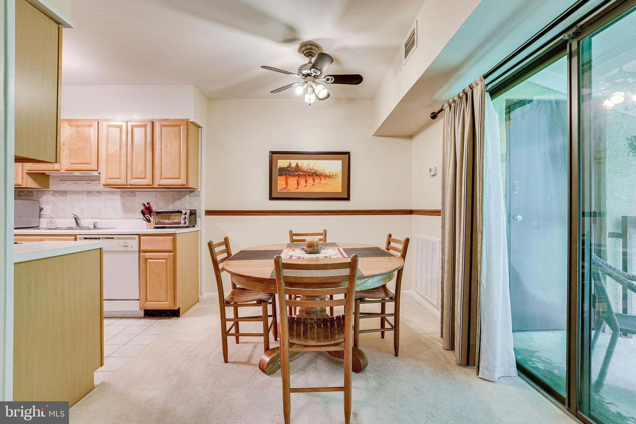 11621 Stoneview Square, Unit 22C Reston, VA 20191 - Photo 13 of 37 Dining Area with Chair Railing