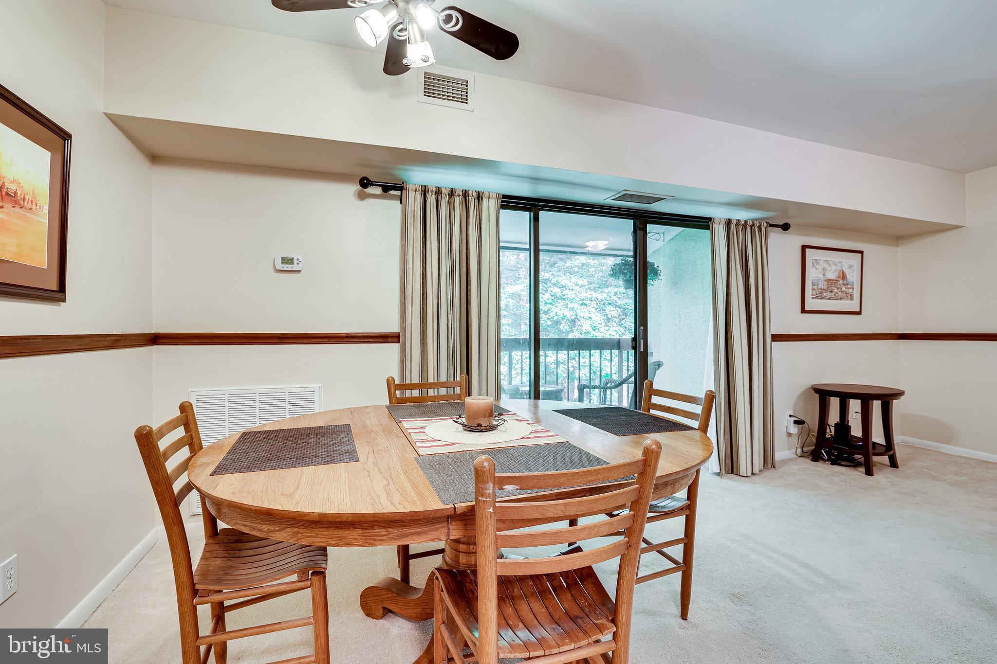 11621 Stoneview Square, Unit 22C Reston, VA 20191 - Photo 15 of 37 Dining Area with Back Deck Access