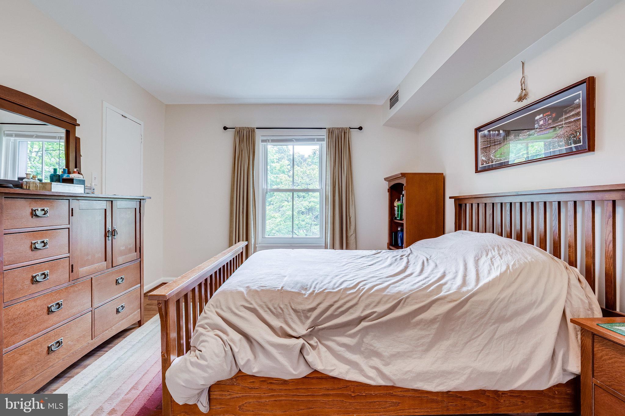 11621 Stoneview Square, Unit 22C Reston, VA 20191 - Photo 19 of 37 Primary Bedroom with Hardwood Flooring