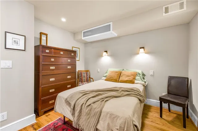 a bedroom with a bed and lamp