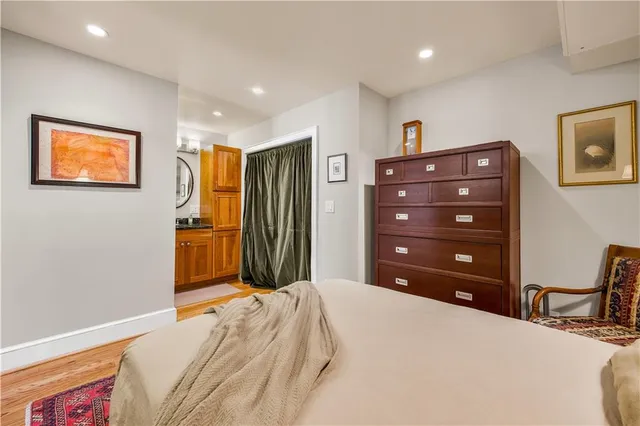a bedroom with a bed and a cabinets