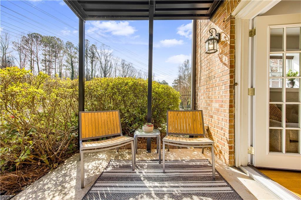 1261 Lavista Road Northeast, Unit E9 Atlanta, GA 30324 - Photo 24 of 27 a view of an outdoor space with seating area