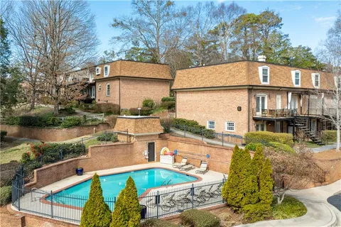 a view of a swimming pool with a patio