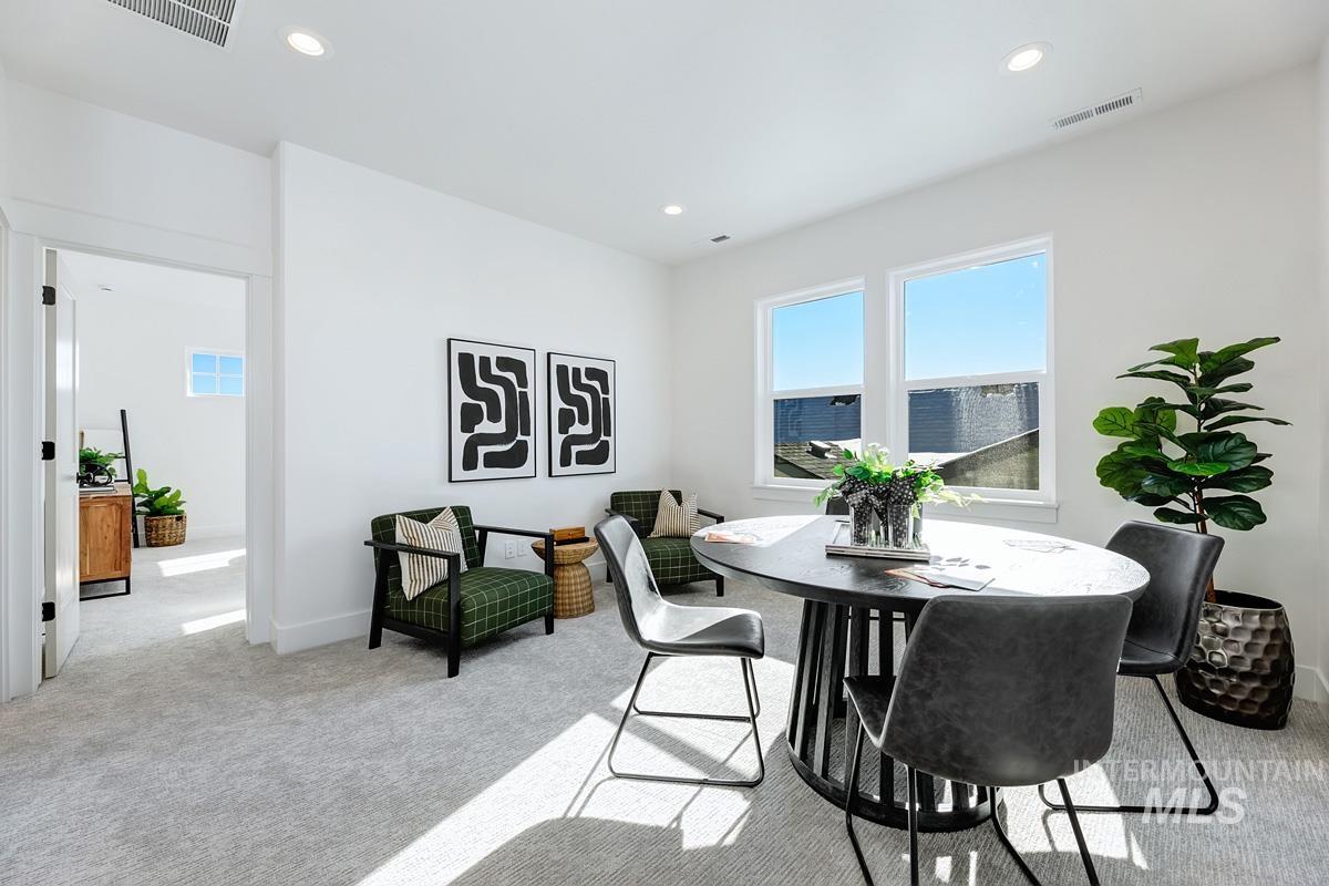 21913 Paint Avenue Star, ID 83669 - Photo 20 of 45 Dining room with light carpet and recessed lighting