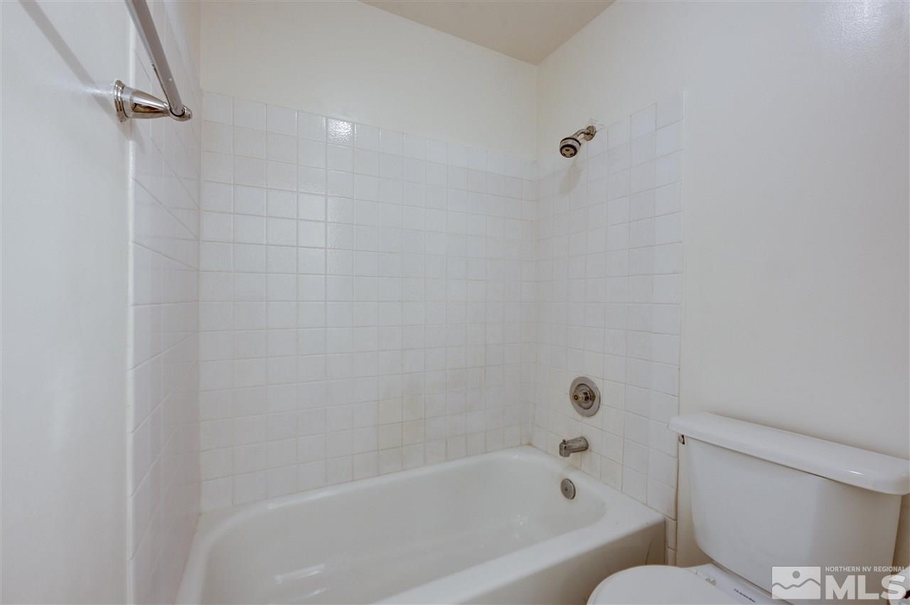 2101 Highview Court, Unit 14 Reno, NV 89512 - Photo 11 of 16 a bathroom with a bathtub