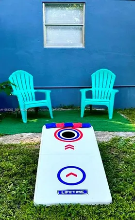 a view of a table and chairs in the garden