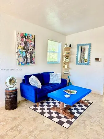 a living room with furniture and a table