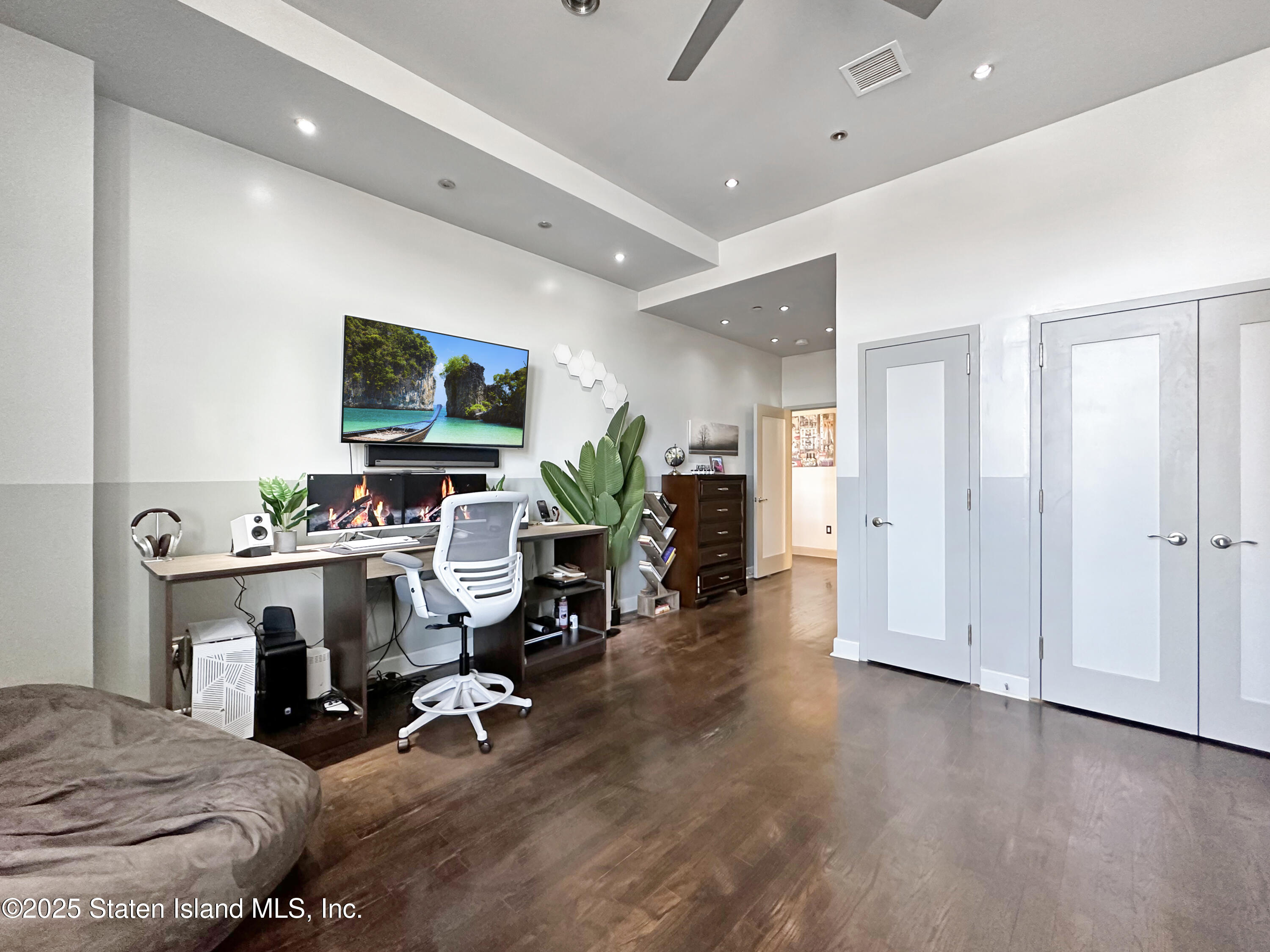 90 Bay Street Landing, Unit 9C Staten Island, NY 10301 - Photo 22 of 38 a view of a livingroom with workspace and a window