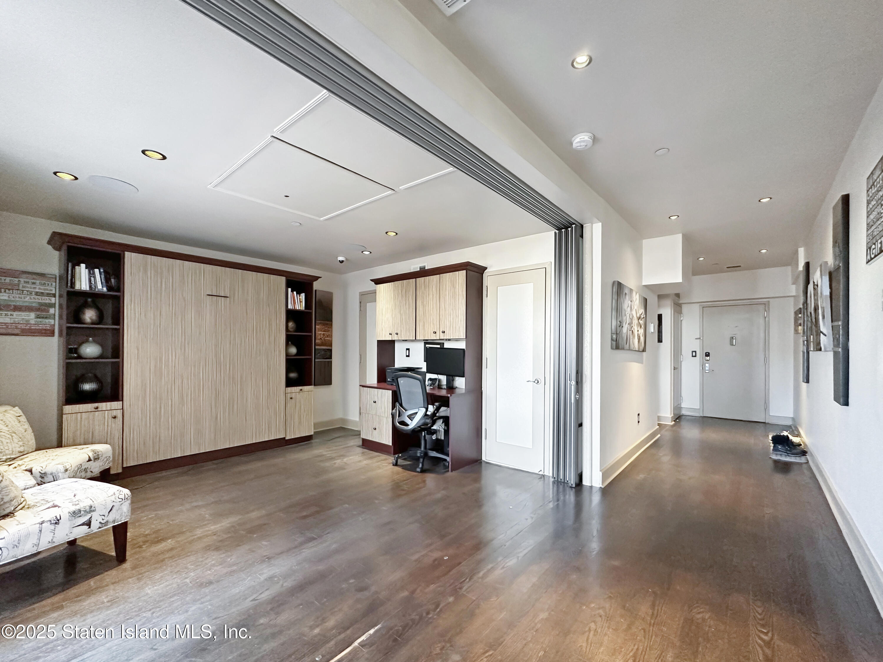 90 Bay Street Landing, Unit 9C Staten Island, NY 10301 - Photo 23 of 38 a view of livingroom with furniture and a ceiling fan
