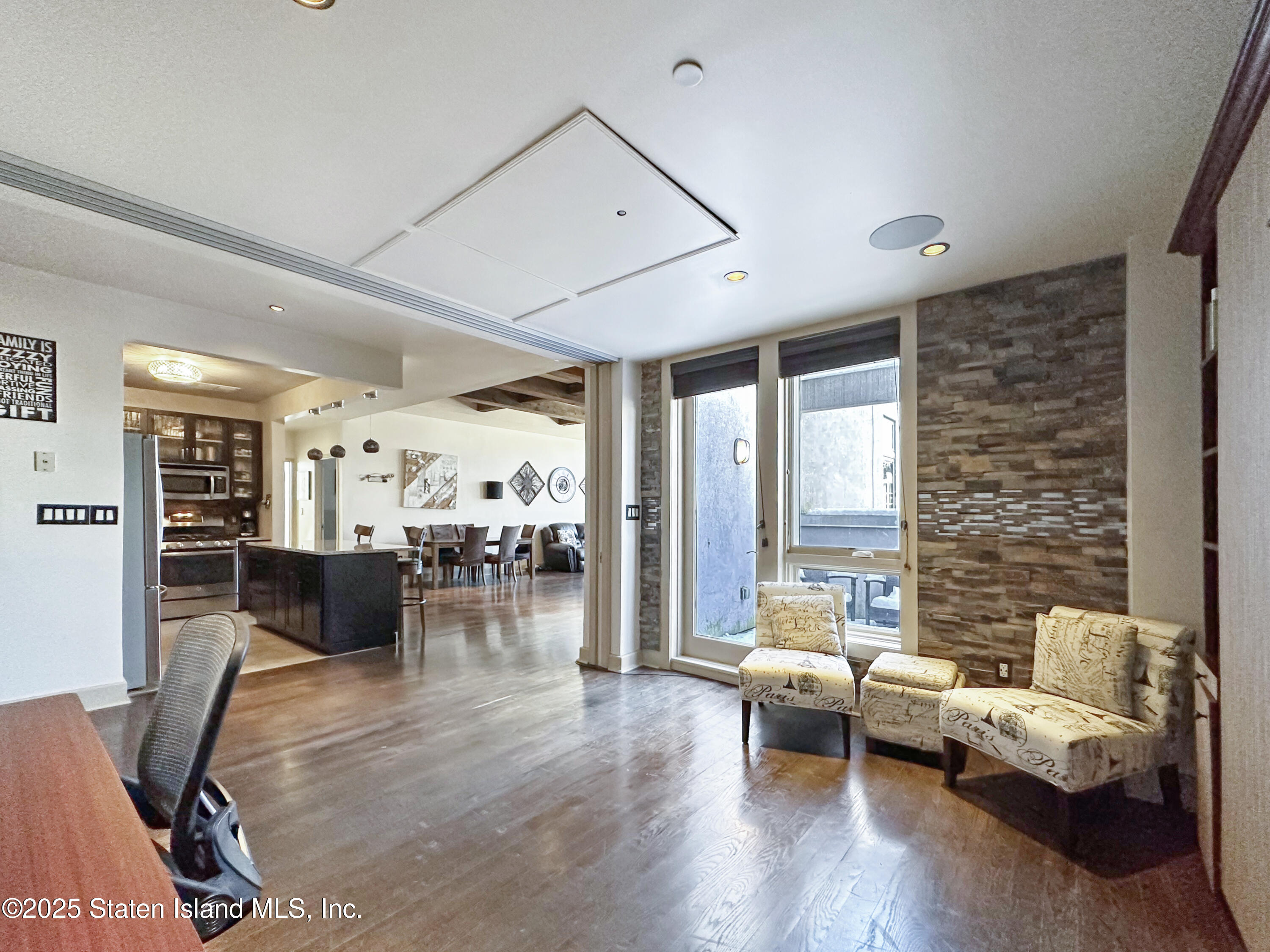 90 Bay Street Landing, Unit 9C Staten Island, NY 10301 - Photo 24 of 38 a living room with furniture and wooden floor