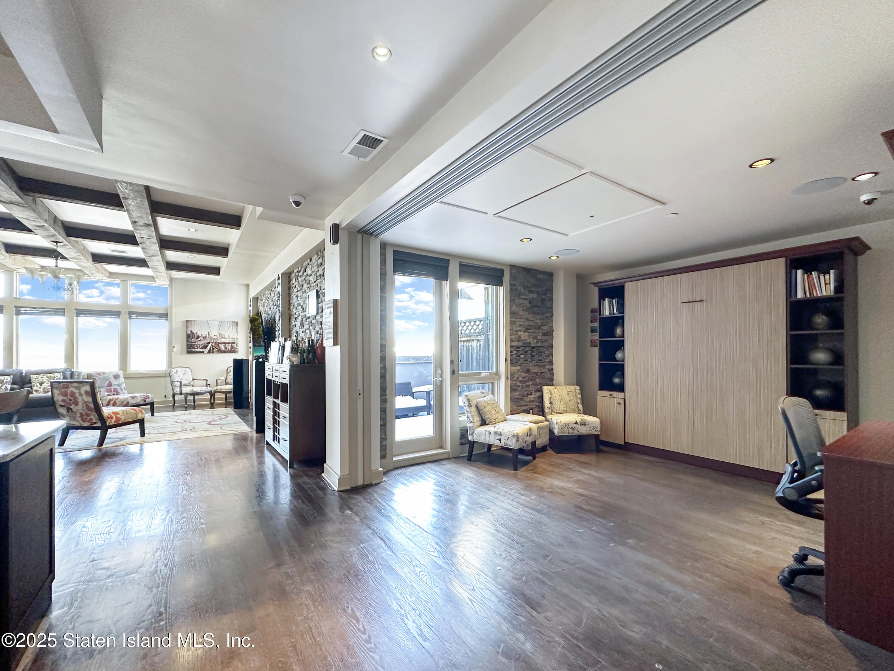 90 Bay Street Landing, Unit 9C Staten Island, NY 10301 - Photo 25 of 38 a living room with furniture window and wooden floor