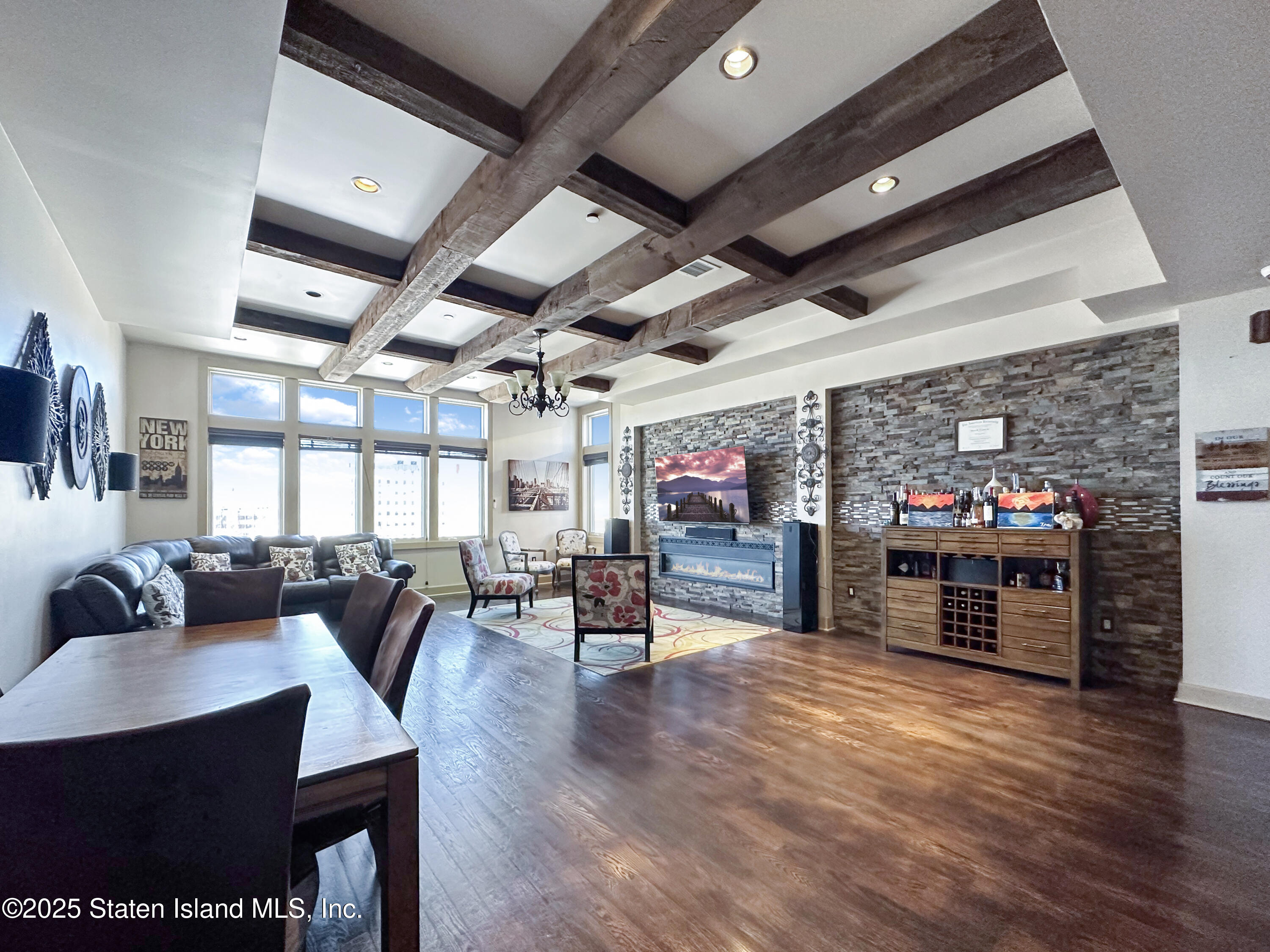 90 Bay Street Landing, Unit 9C Staten Island, NY 10301 - Photo 4 of 38 a view of a dining room with furniture window and wooden floor