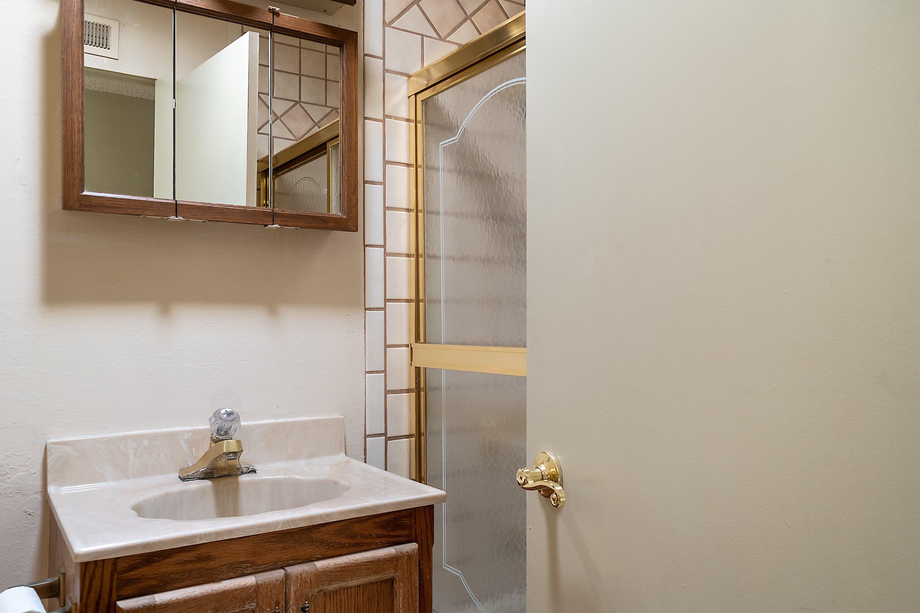 4076 Constellation Road Lompoc, CA 93436 - Photo 13 of 21 a bathroom with a sink and a mirror