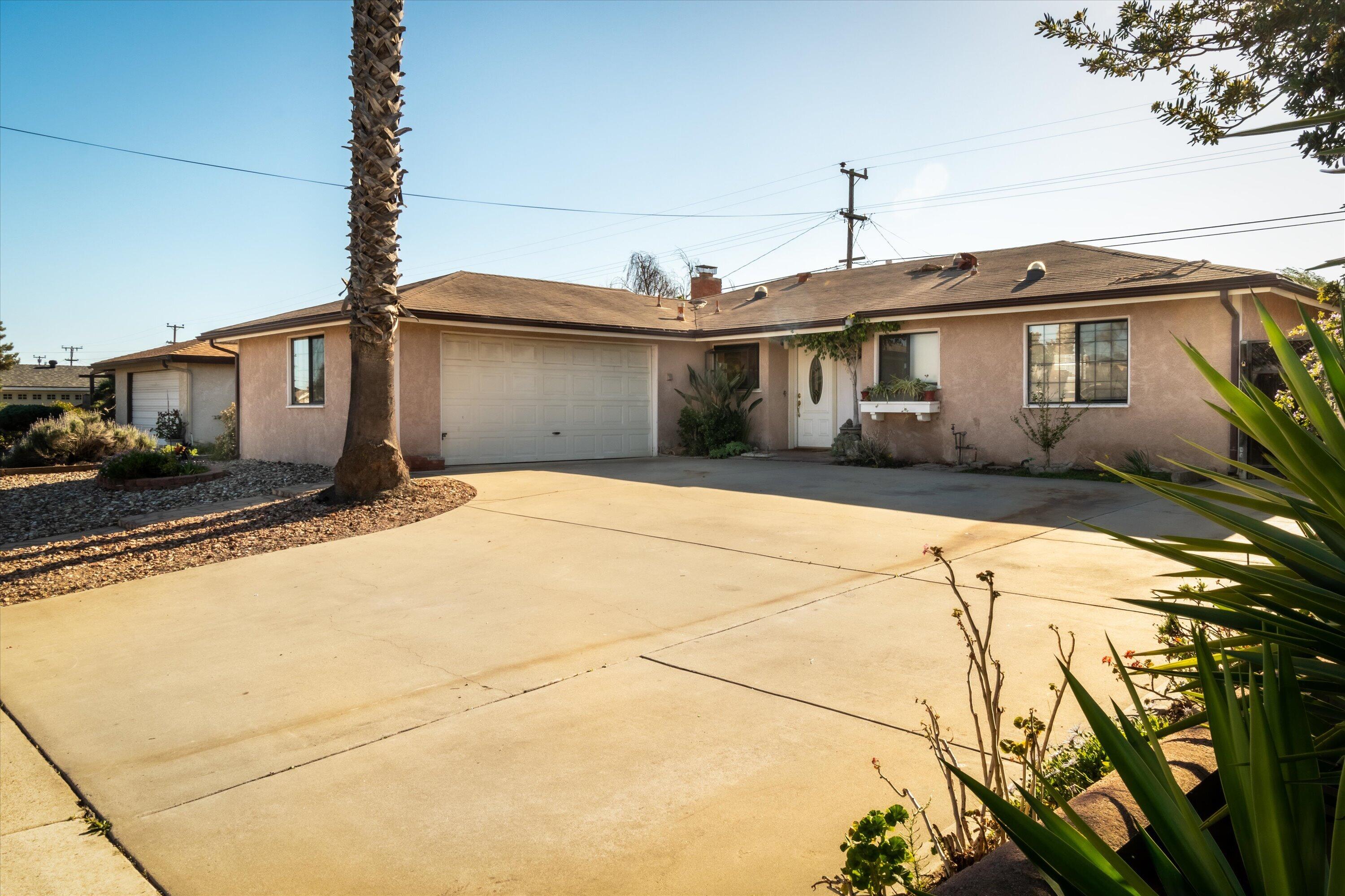 4076 Constellation Road Lompoc, CA 93436 - Photo 2 of 21 a front view of a house with a yard