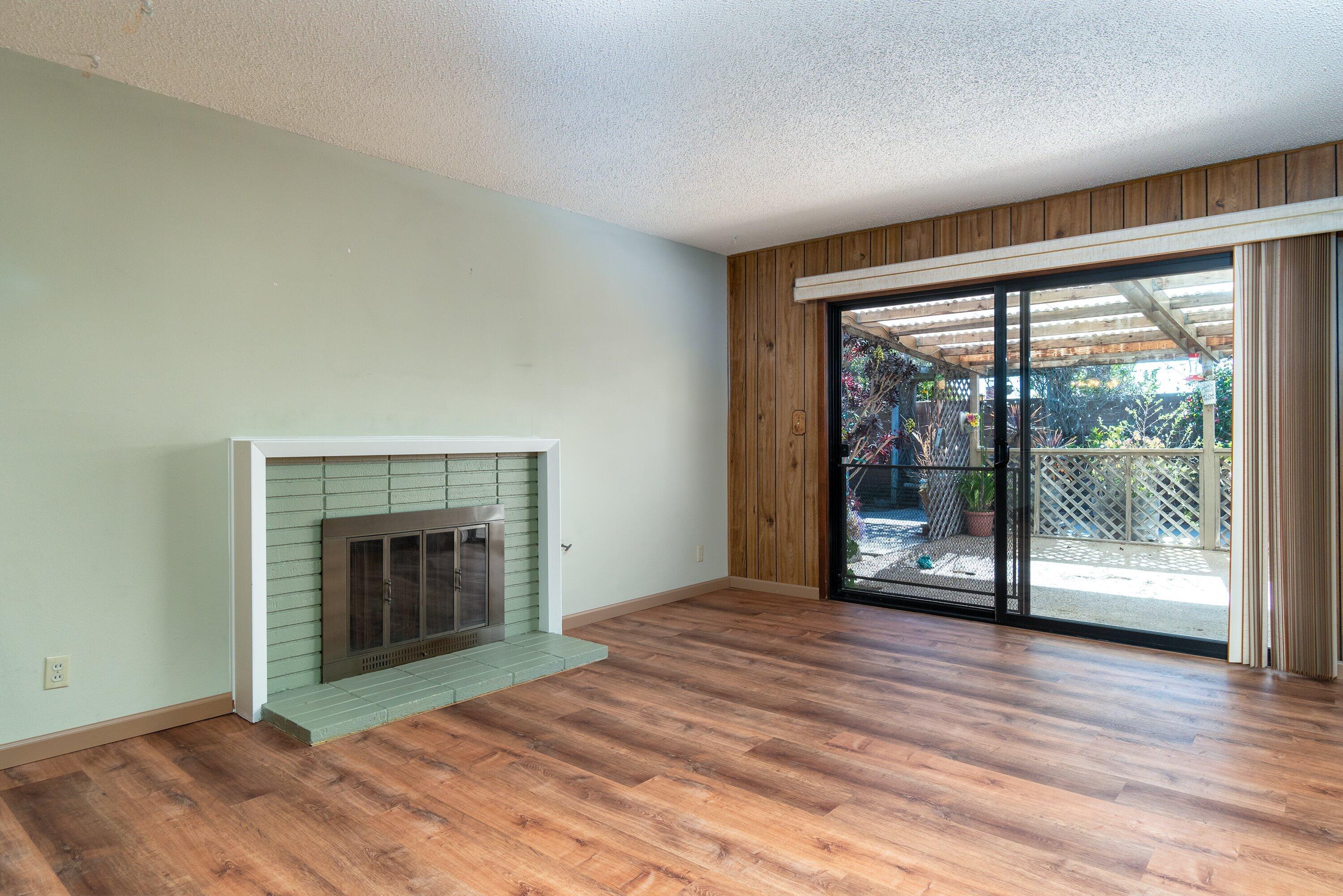 4076 Constellation Road Lompoc, CA 93436 - Photo 3 of 21 a view of empty room with wooden floor and fireplace