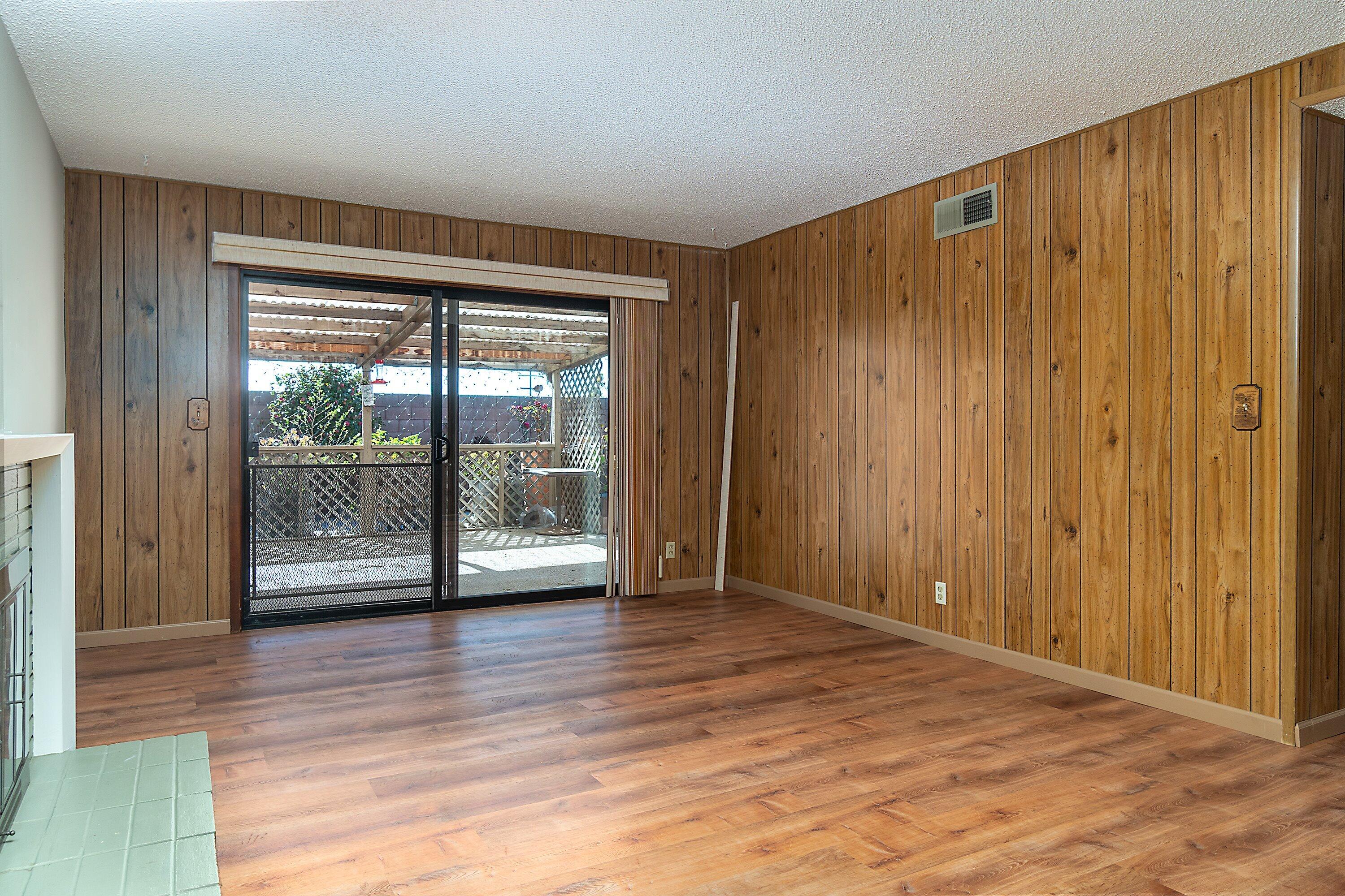 4076 Constellation Road Lompoc, CA 93436 - Photo 4 of 21 a view of an empty room with wooden floor and a window