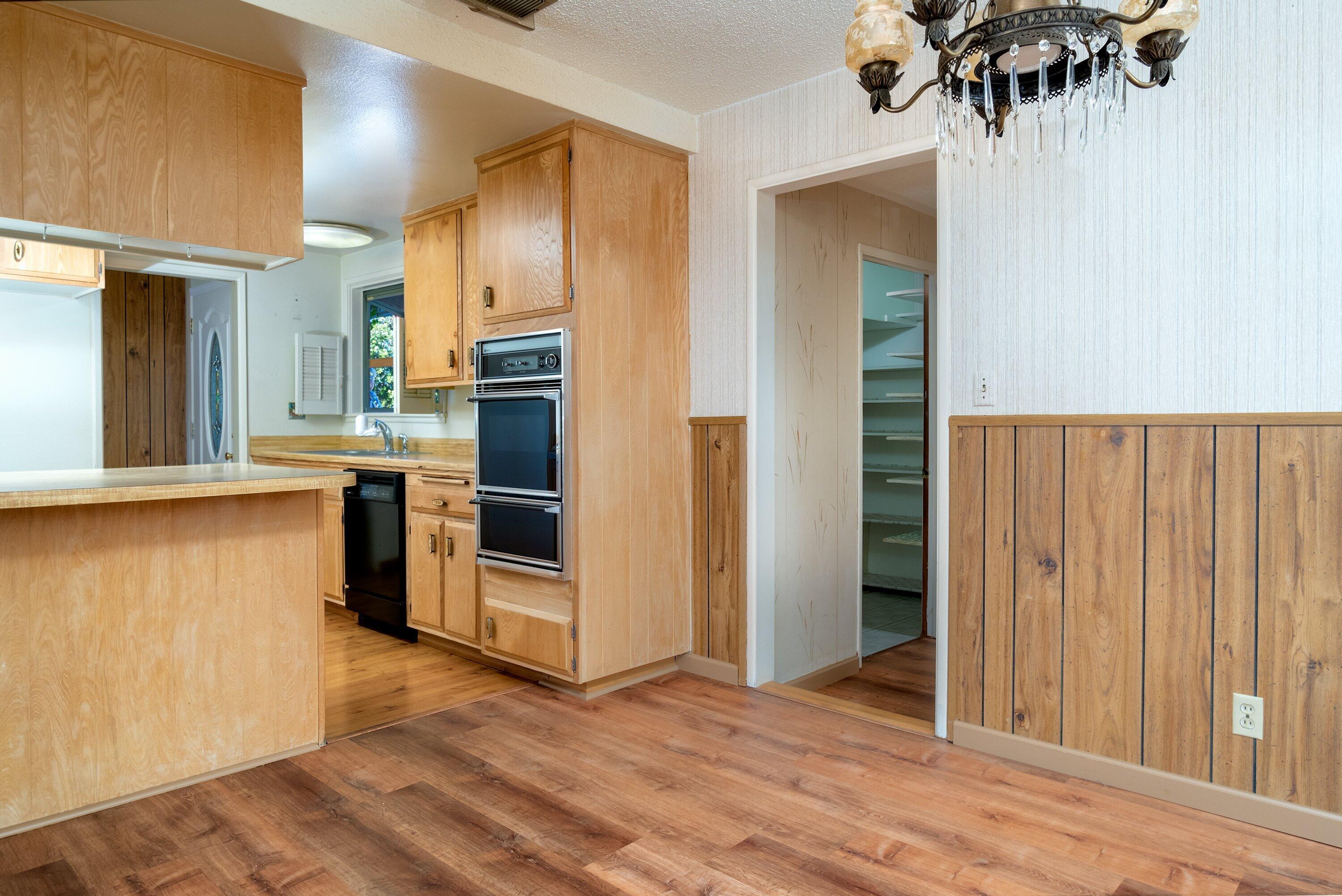 4076 Constellation Road Lompoc, CA 93436 - Photo 5 of 21 a view of a kitchen with a sink and a refrigerator