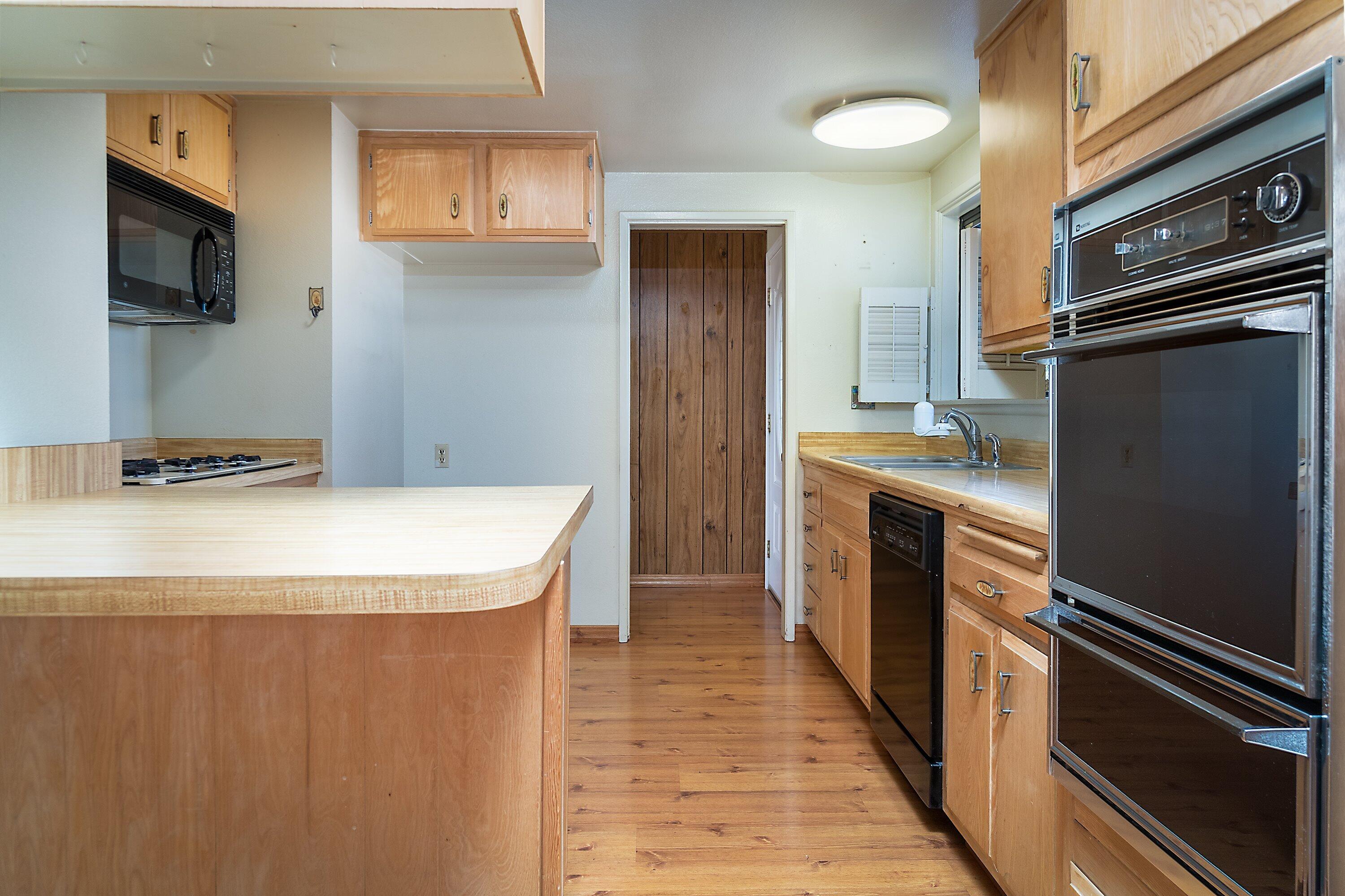 4076 Constellation Road Lompoc, CA 93436 - Photo 7 of 21 a kitchen with stainless steel appliances a refrigerator and a stove top oven