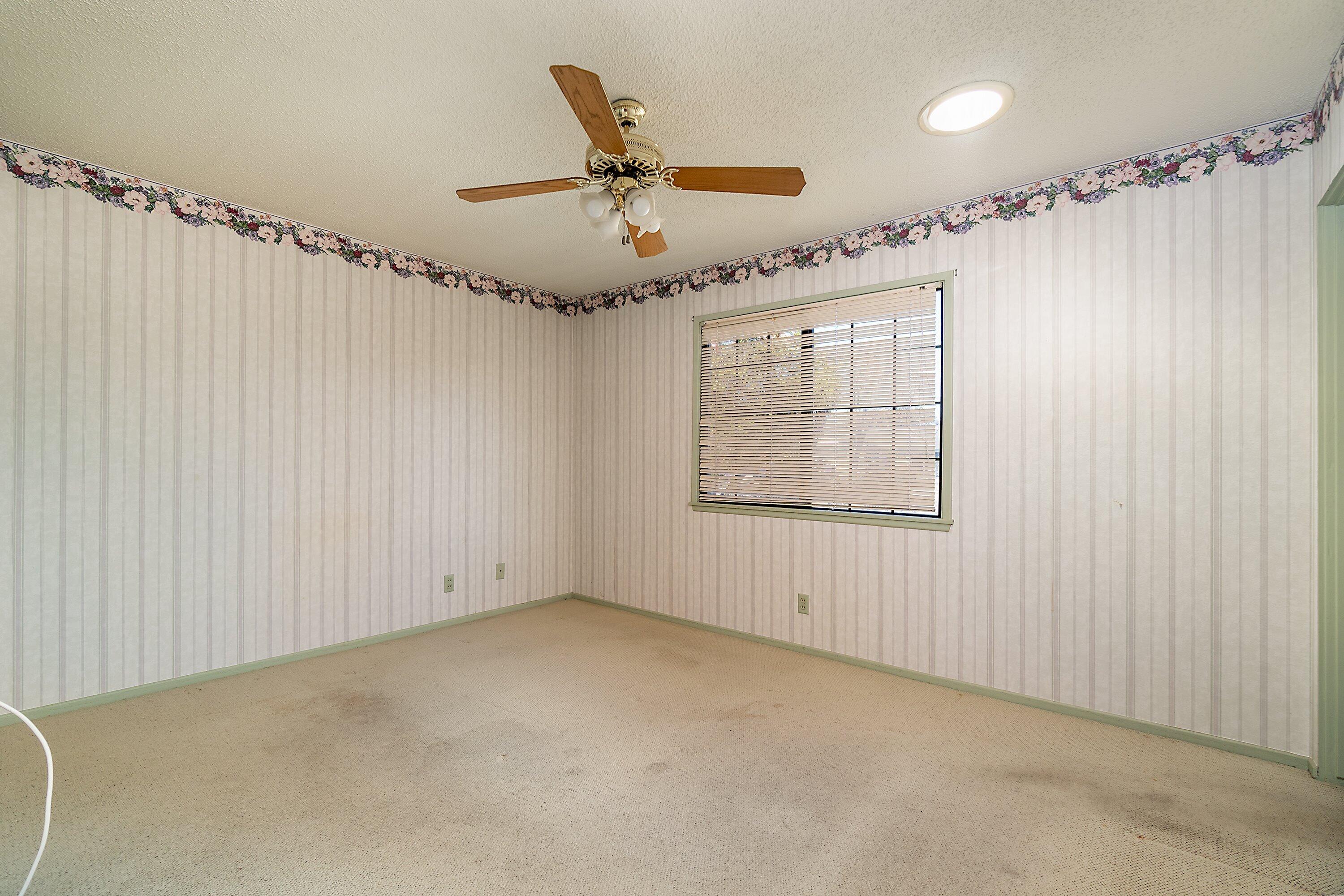 4076 Constellation Road Lompoc, CA 93436 - Photo 8 of 21 a view of a livingroom with a ceiling fan and window