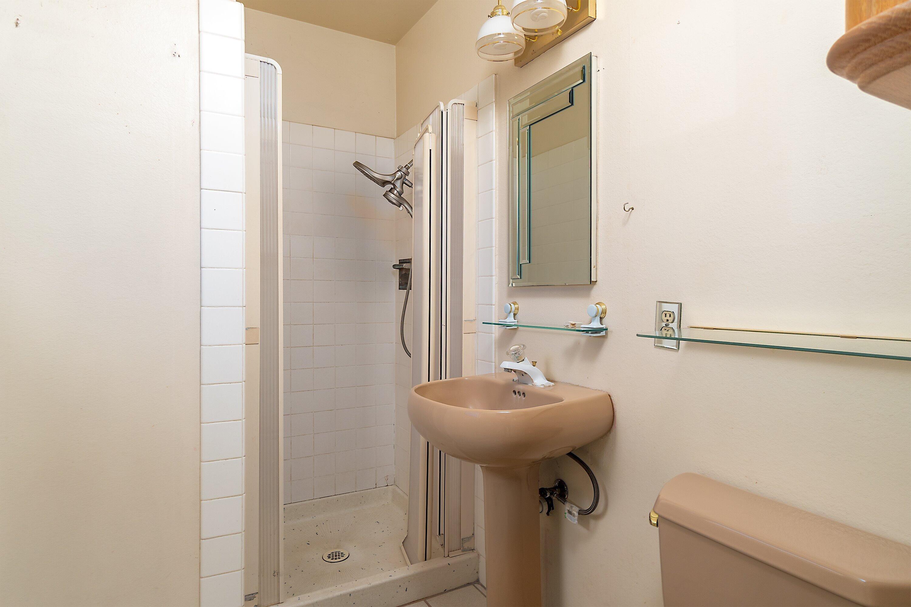4076 Constellation Road Lompoc, CA 93436 - Photo 9 of 21 a bathroom with a sink toilet and shower
