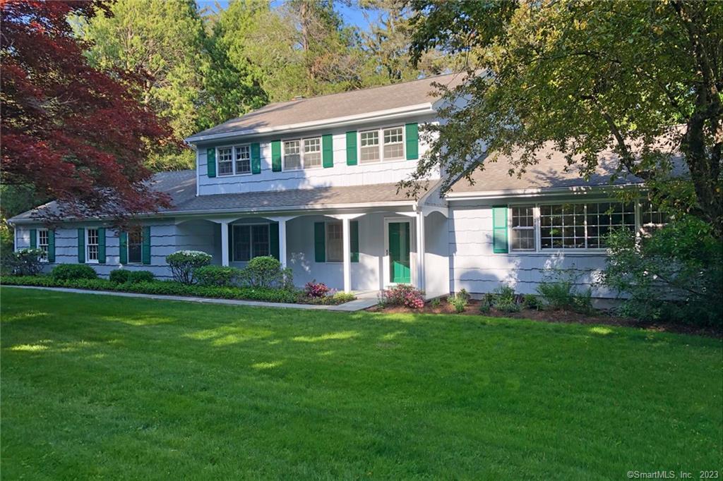 177 Brett Road Fairfield, CT 06824 - Photo 3 of 26 front view of a house with a yard