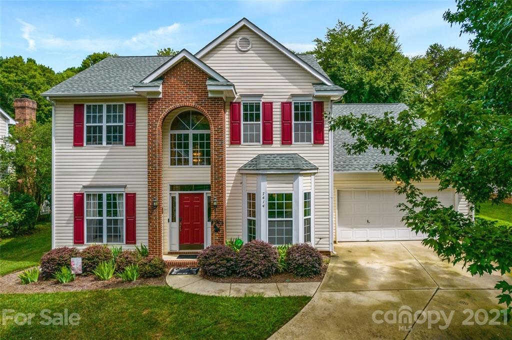 7414 Reedy Creek Road Charlotte, NC 28215 - Photo 1 of 34 a front view of a house with garden