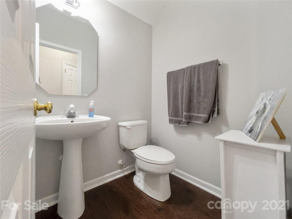 7414 Reedy Creek Road Charlotte, NC 28215 - Photo 14 of 34 a bathroom with a sink toilet and mirror