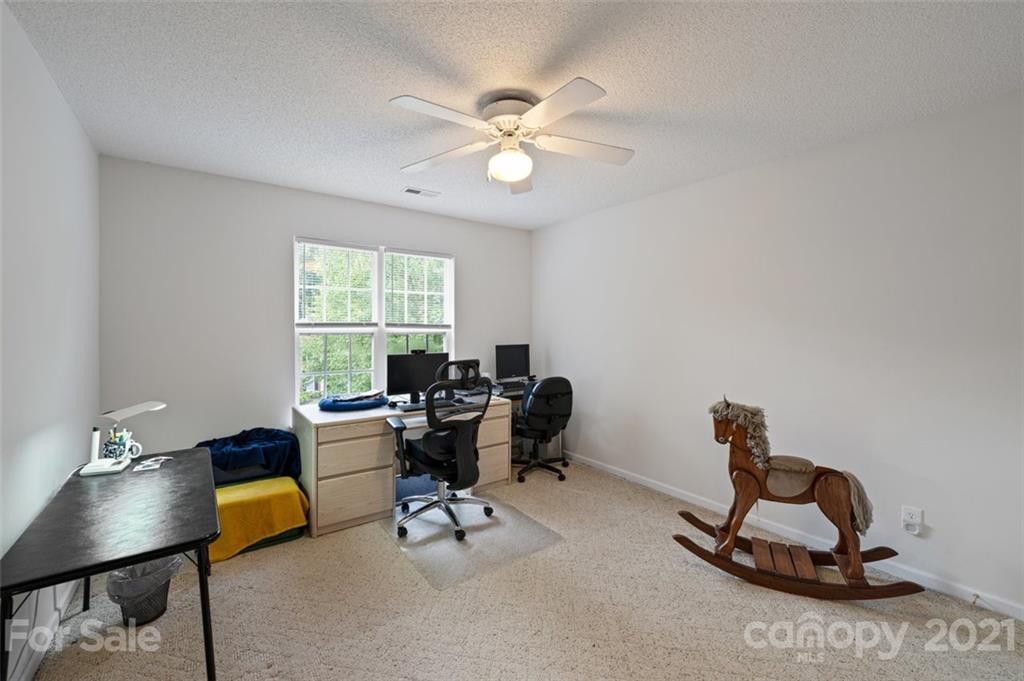 7414 Reedy Creek Road Charlotte, NC 28215 - Photo 22 of 34 a living room with furniture a window and a window